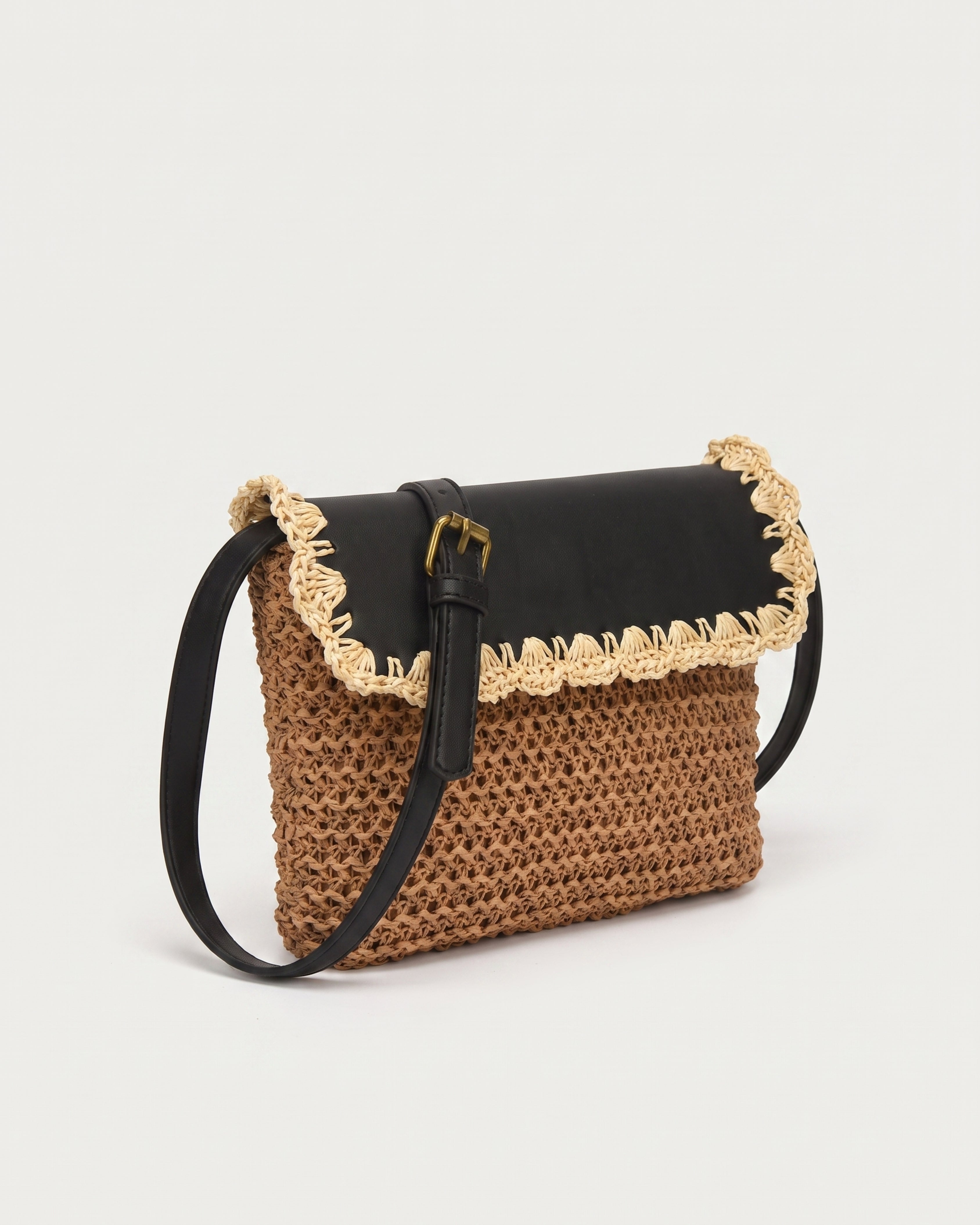 Woven Straw Crossbody Bag in brown with black — three-quarter view, RABUKO