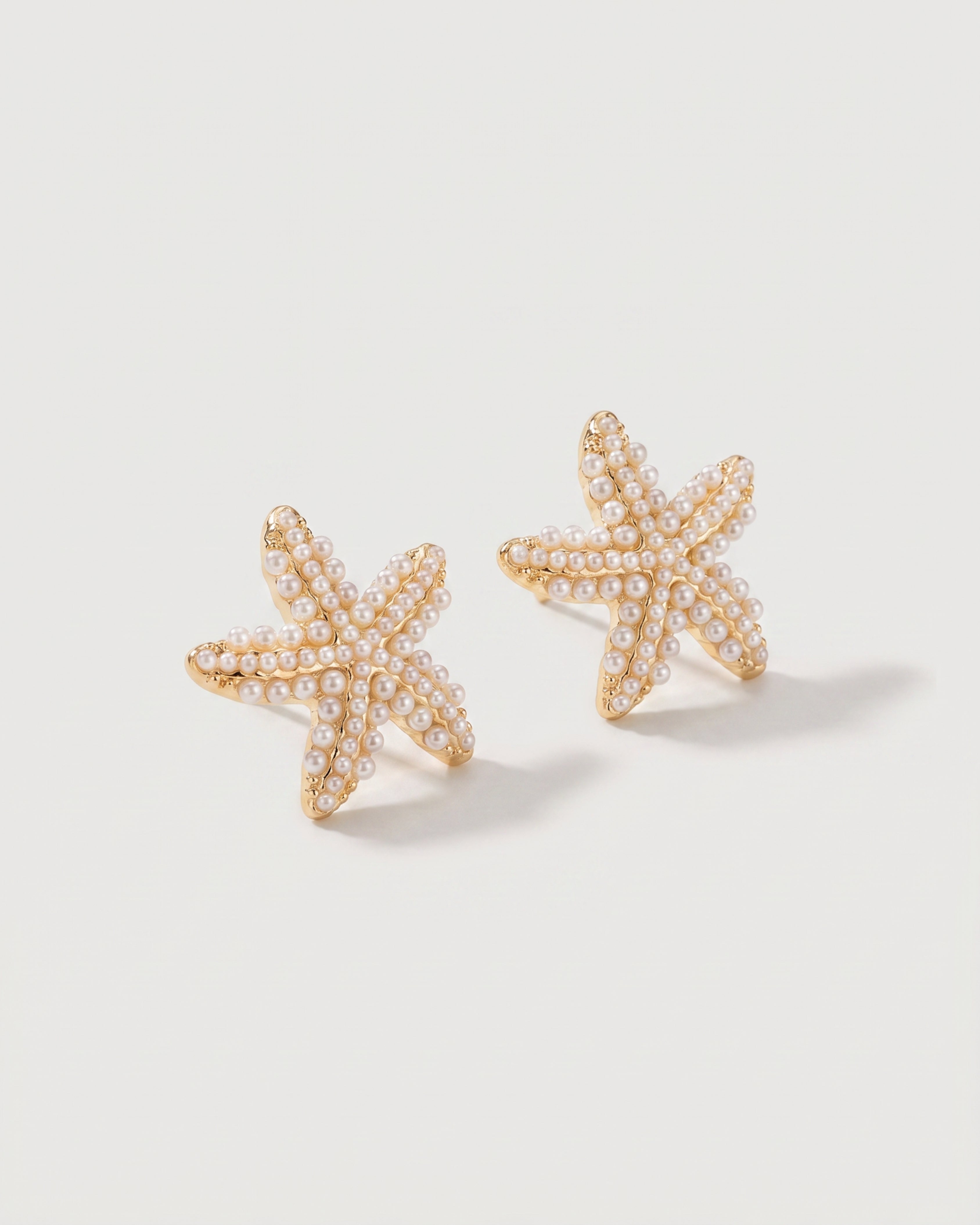 Pineapple Starfish Pearl Earrings in starfish pearl — three-quarter view, RABUKO