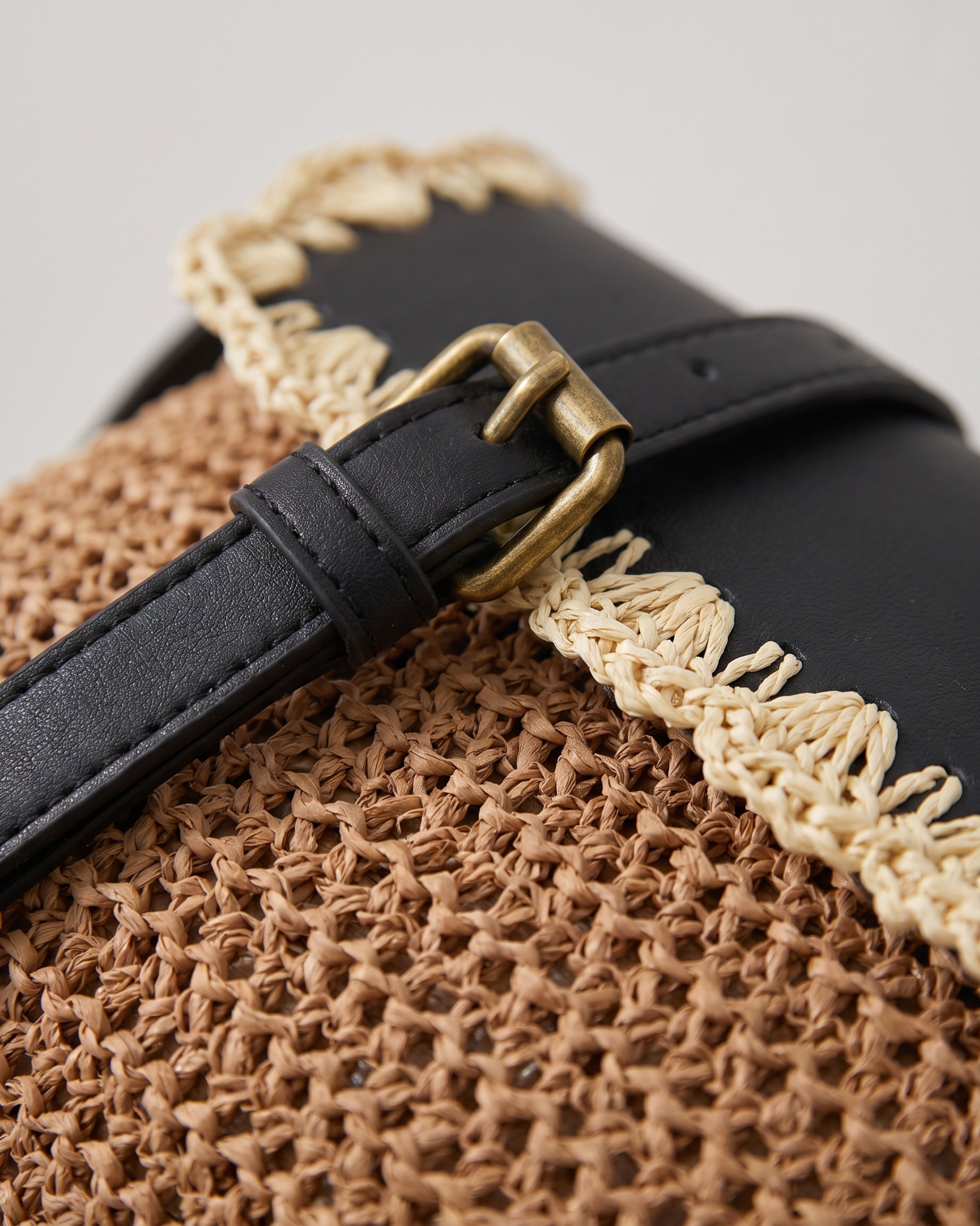 Woven Straw Crossbody Bag in brown with black — weave detail, RABUKO