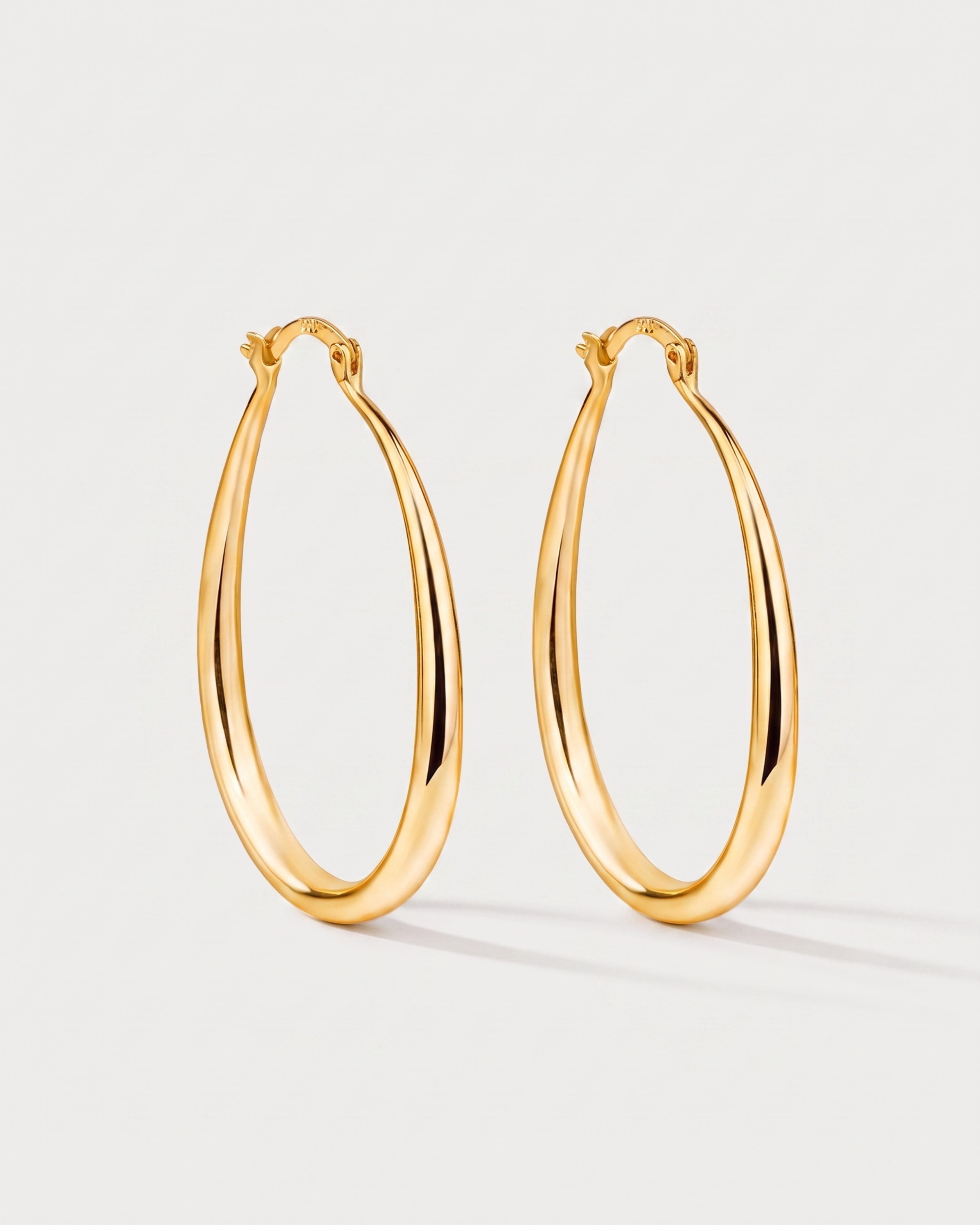 Geometric Oval Earrings in gold — front view, RABUKO