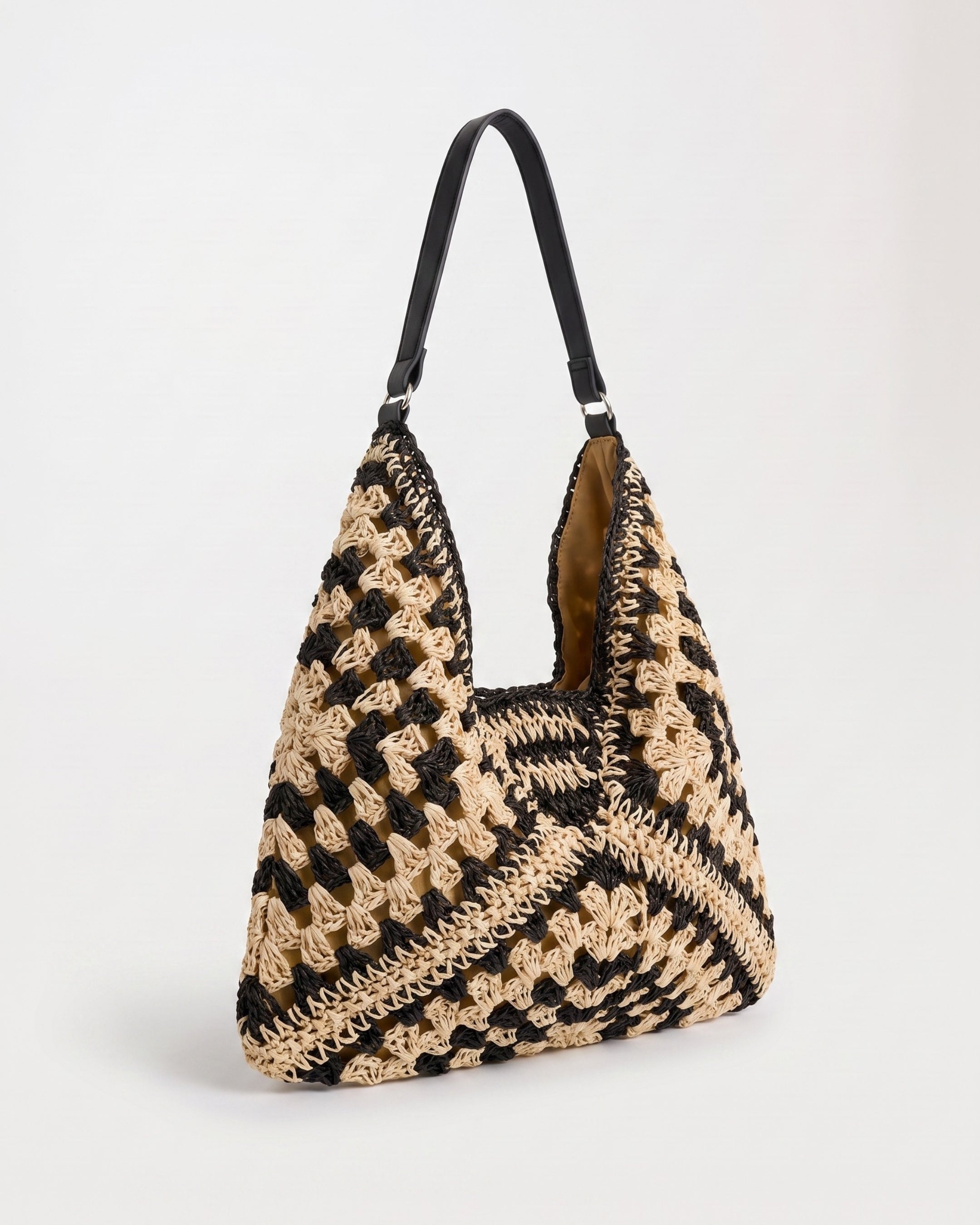 Cutout Straw Shoulder Bag in black khaki — three-quarter view, RABUKO