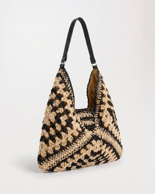 Cutout Straw Shoulder Bag in black khaki — three-quarter view, RABUKO
