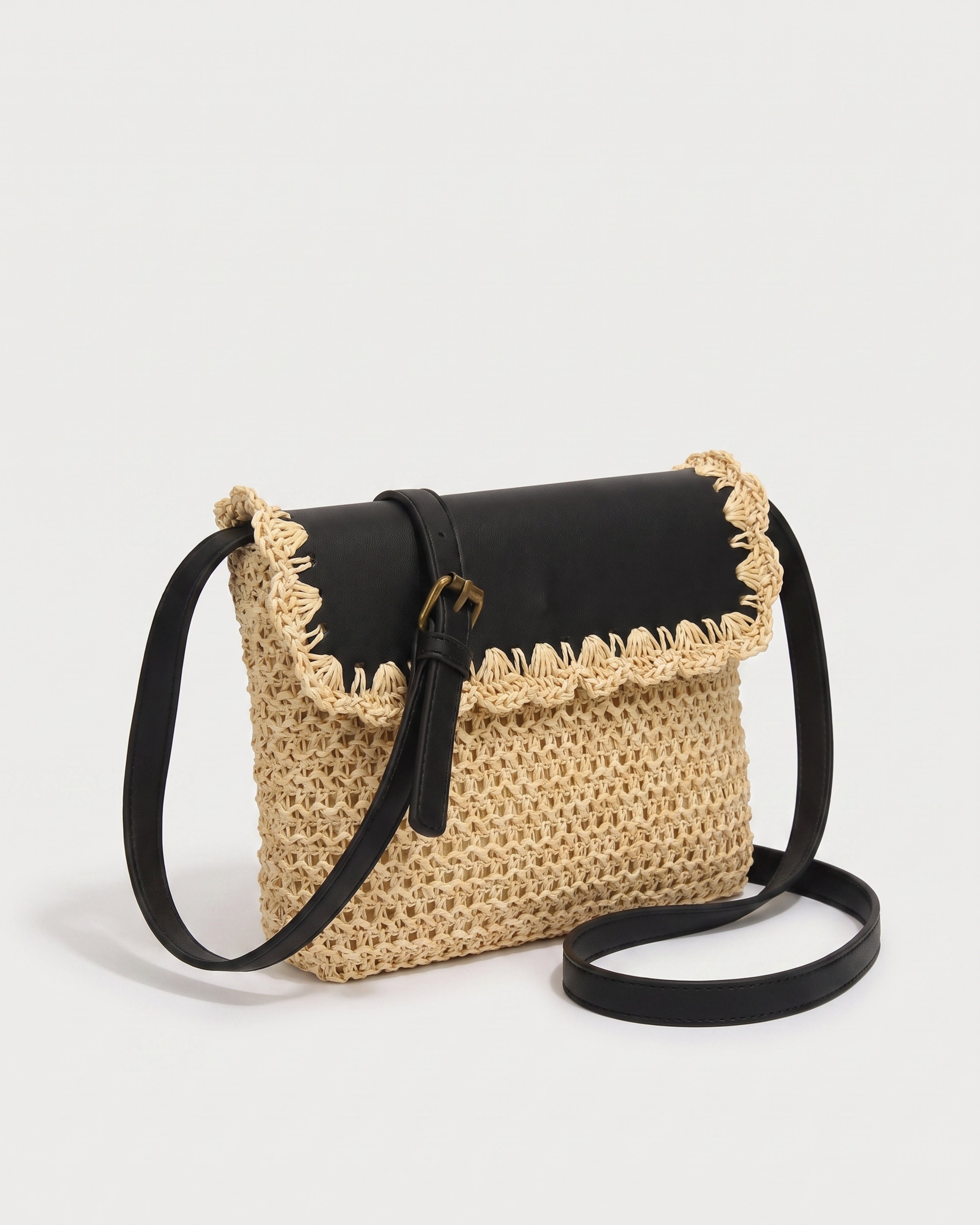Woven Straw Crossbody Bag in beige with black — three-quarter view, RABUKO