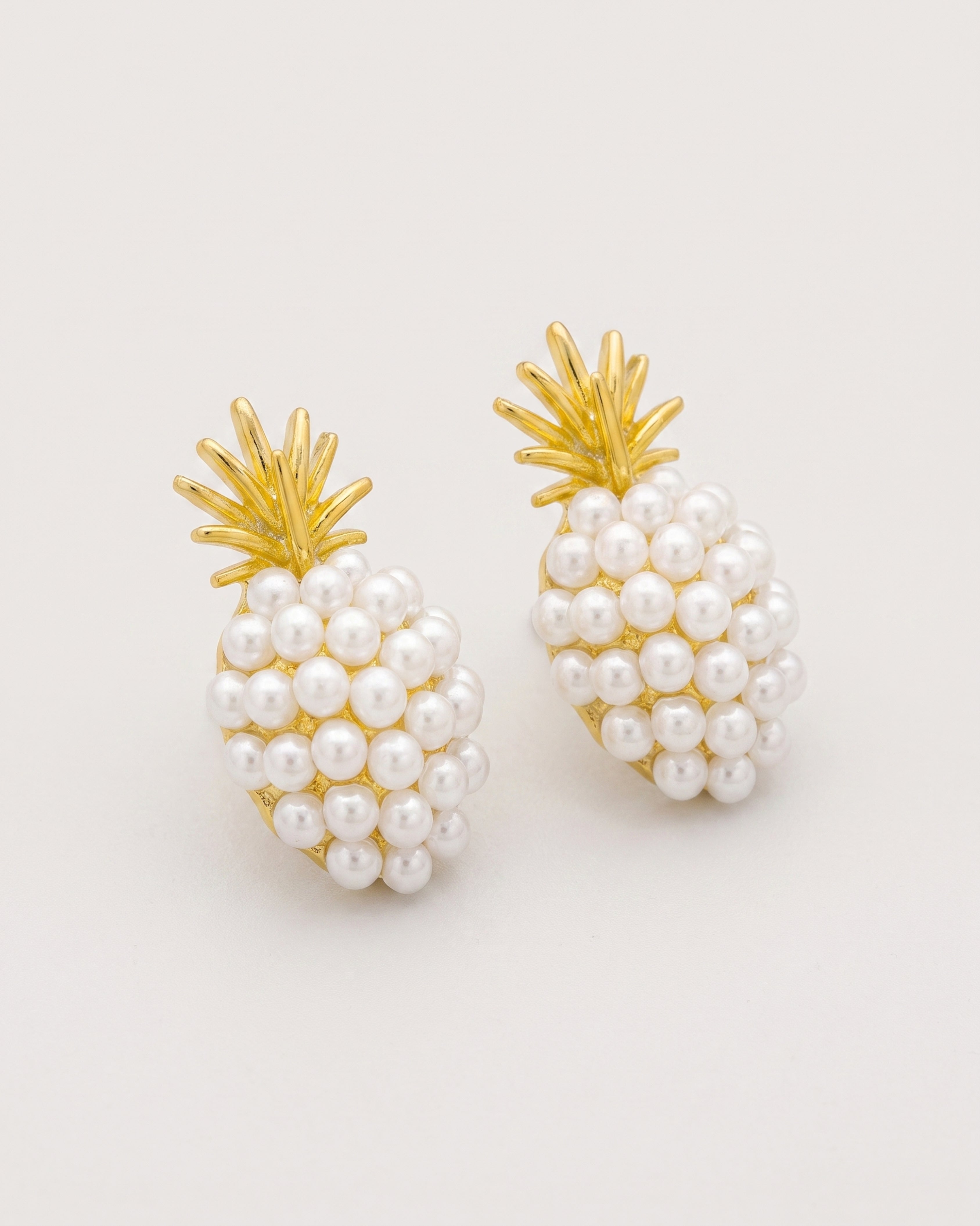 Pineapple Starfish Pearl Earrings in gold — three-quarter view, RABUKO