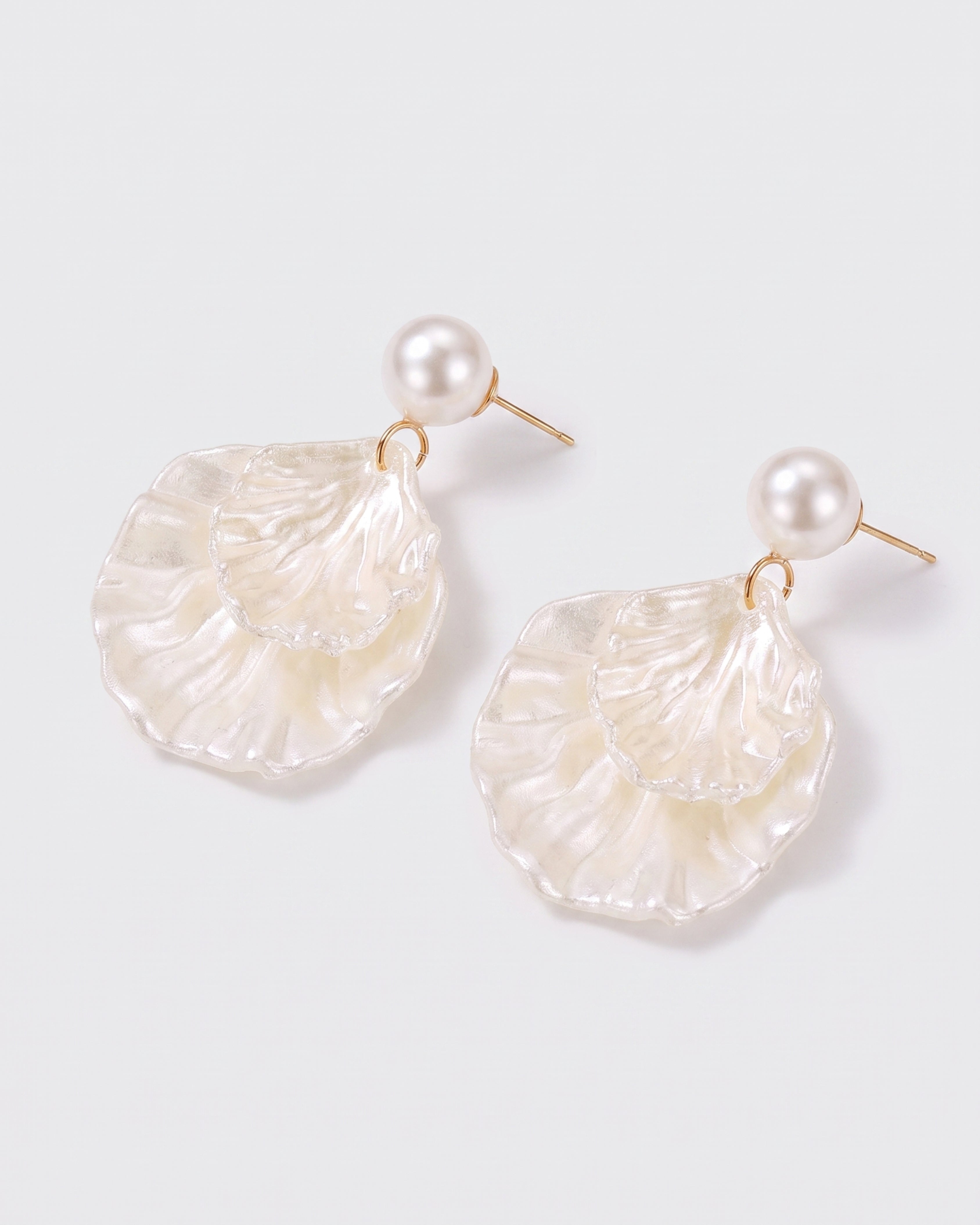 Pearl Shell Earrings — three-quarter view, RABUKO
