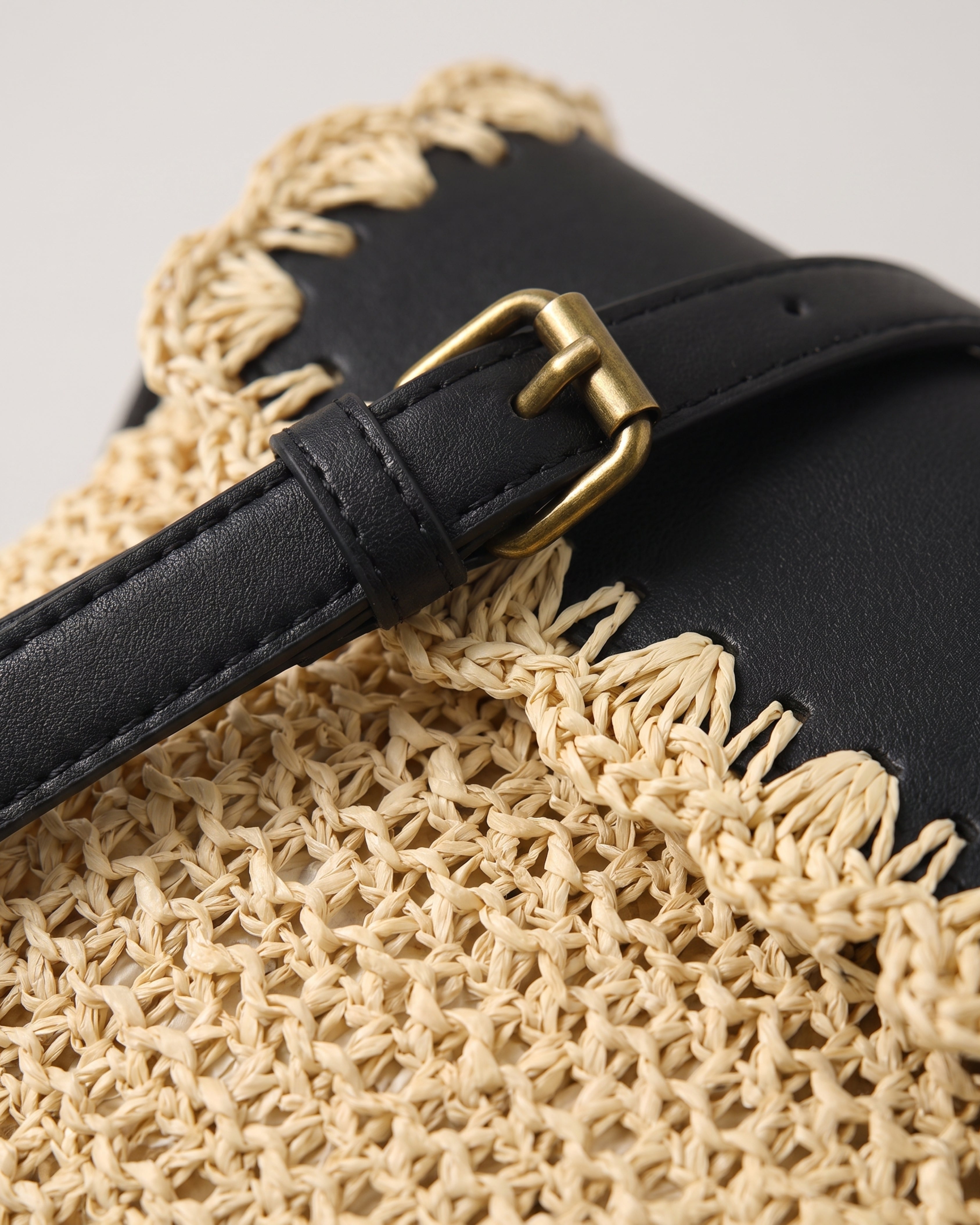 Woven Straw Crossbody Bag in beige with black — weave detail, RABUKO
