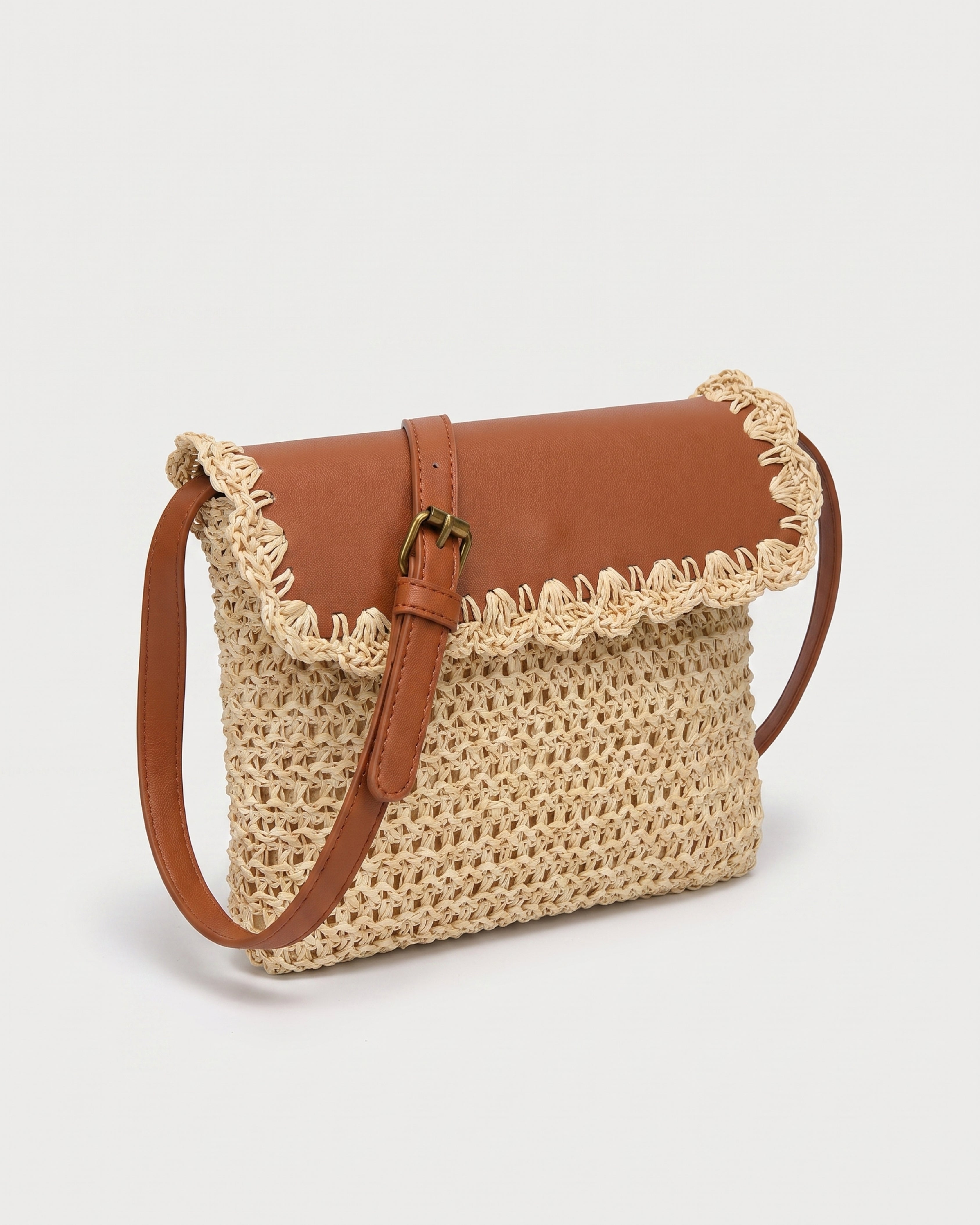 Woven Straw Crossbody Bag in beige with brown — three-quarter view, RABUKO