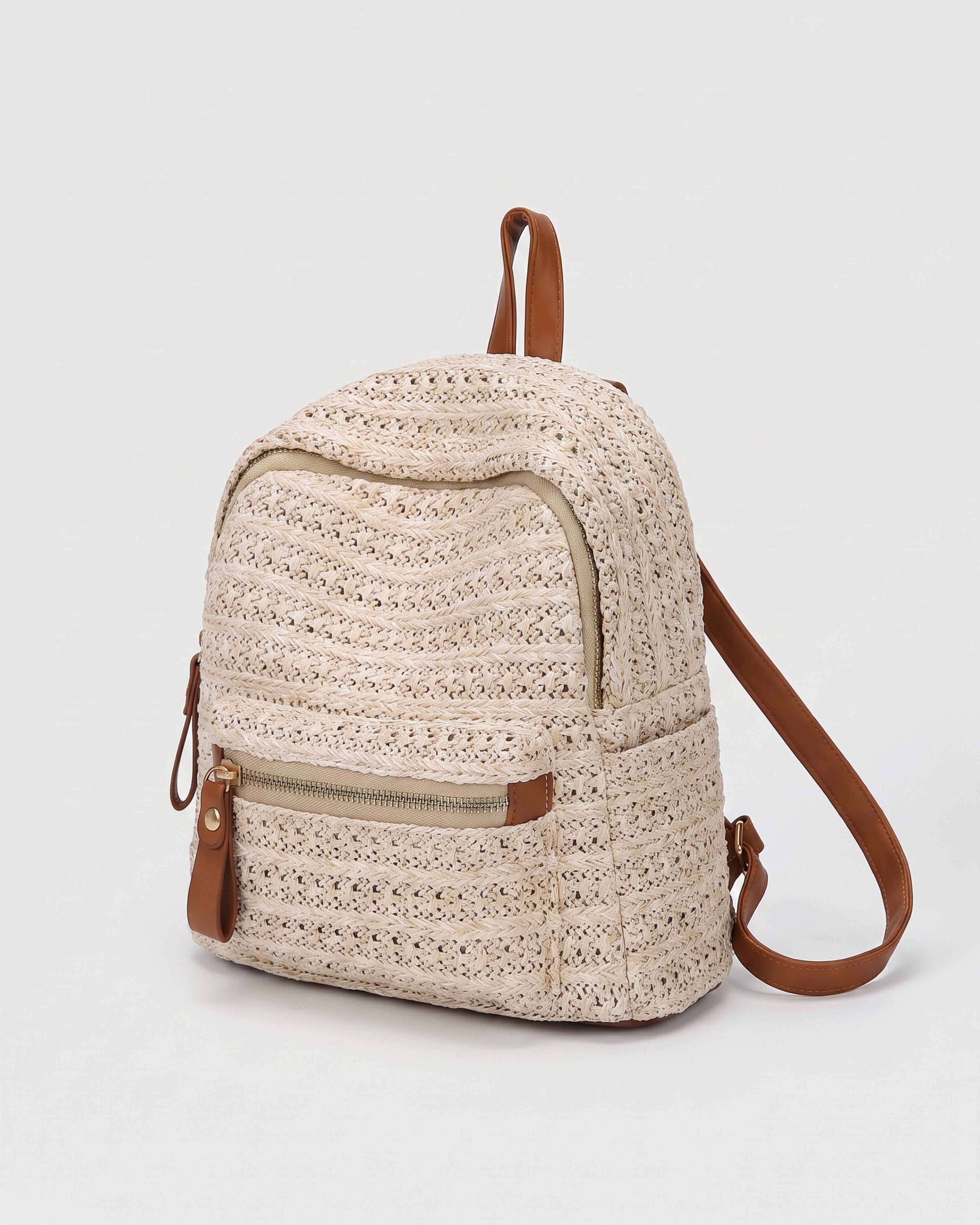 Woven Straw Backpack in beige — three-quarter view, RABUKO