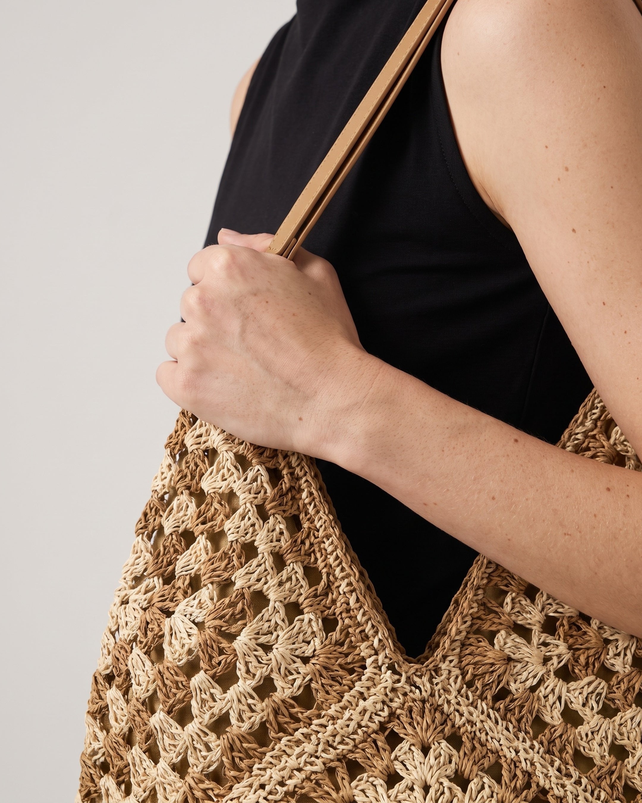 Cutout Straw Shoulder Bag in khaki beige — back view, RABUKO