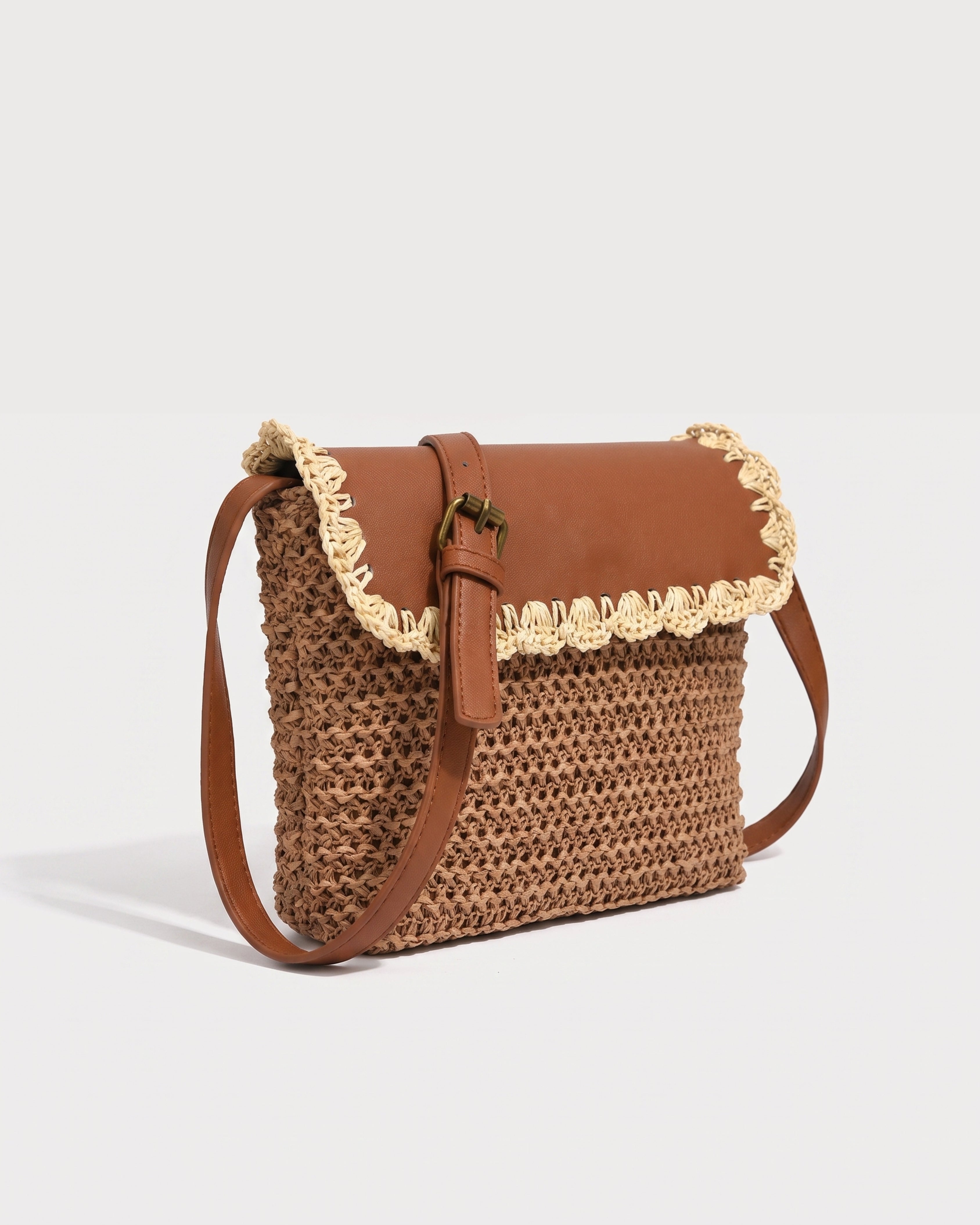 Woven Straw Crossbody Bag in brown — three-quarter view, RABUKO