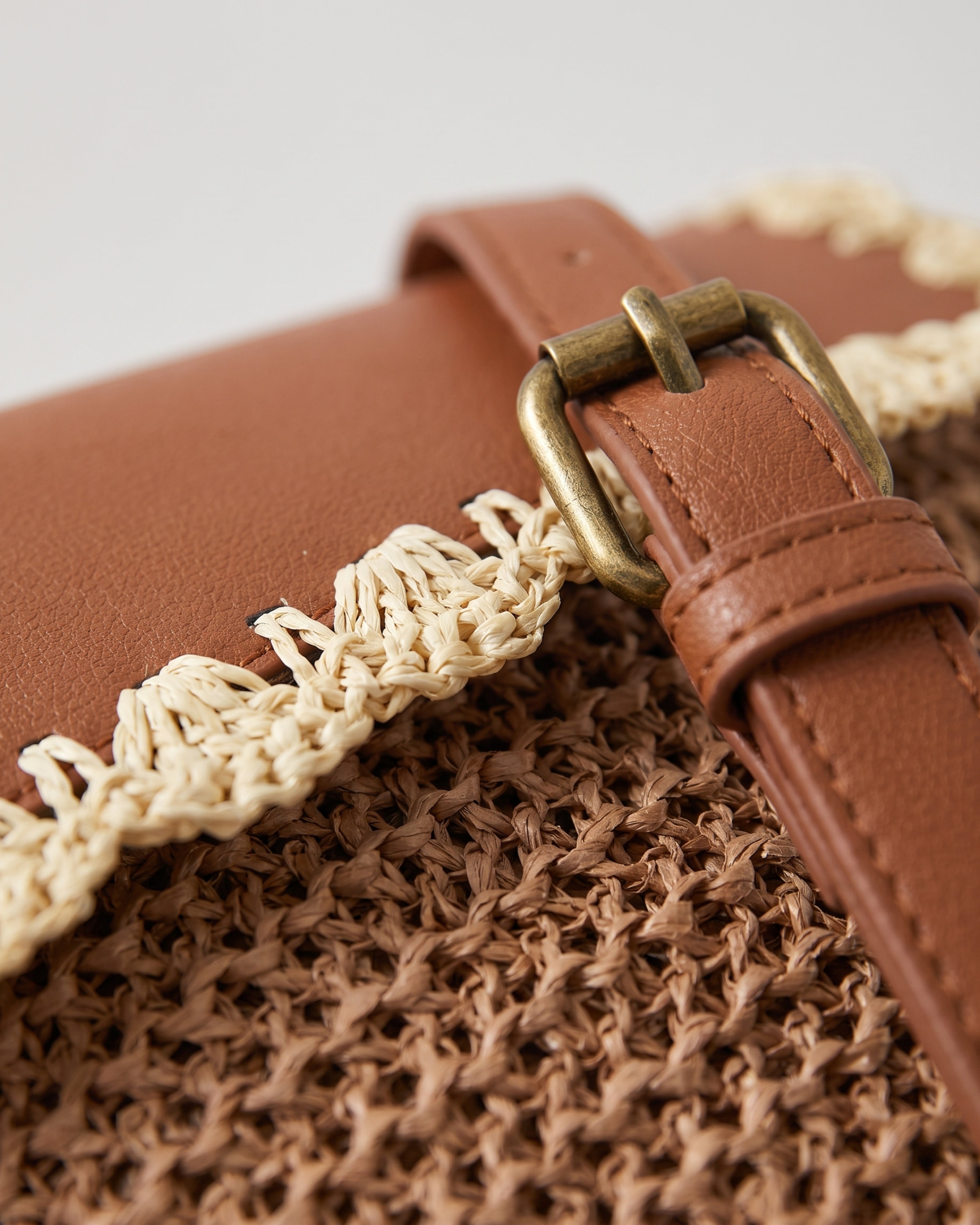 Woven Straw Crossbody Bag in brown — weave detail, RABUKO