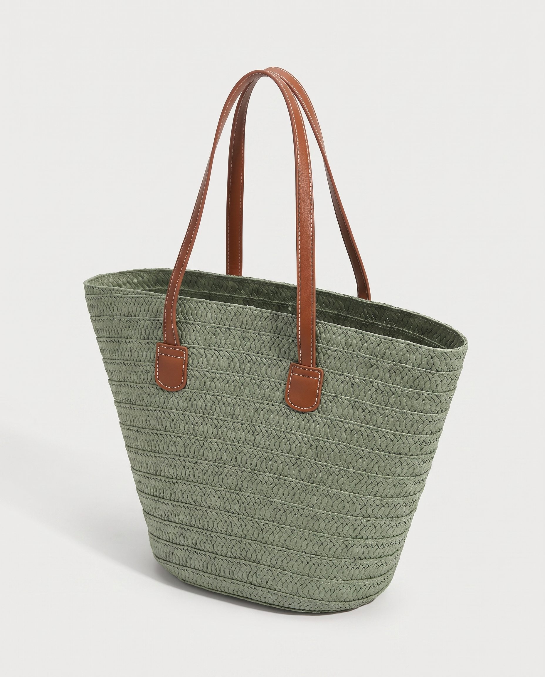 Contrast straw tote in green — three-quarter view, RABUKO