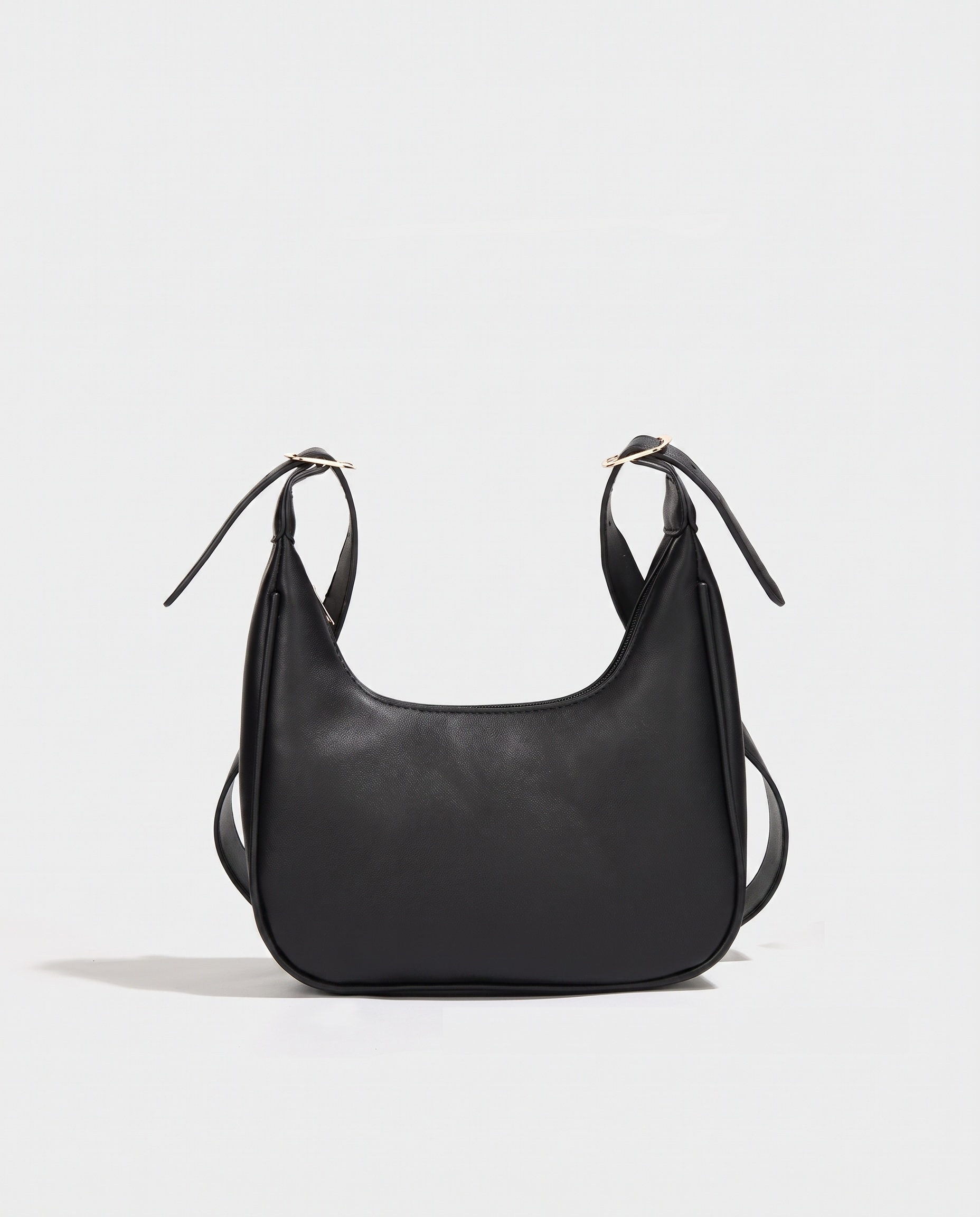 Crescent mini crossbody bag in black — front view, RABUKO