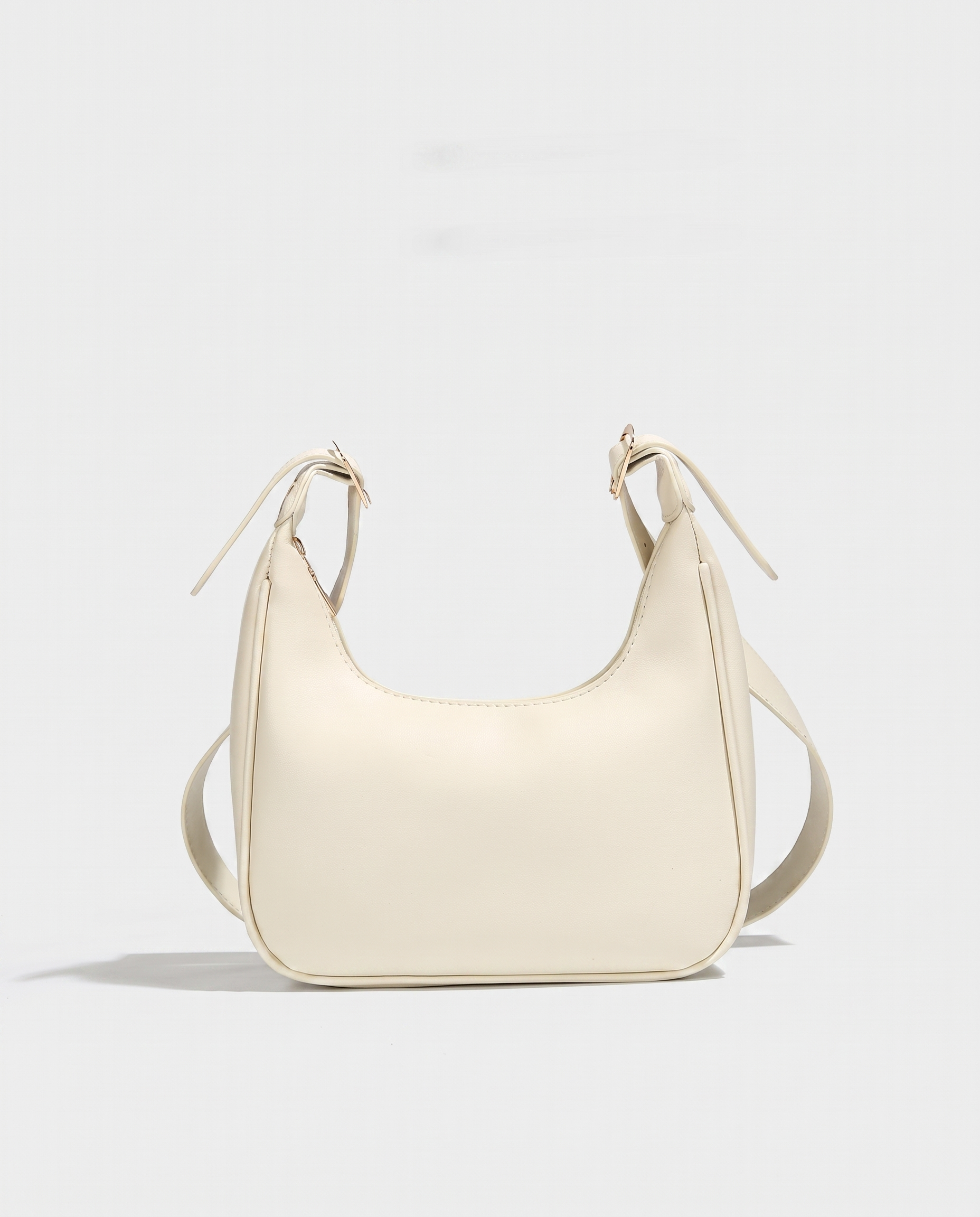 Crescent mini crossbody bag in white — front view, RABUKO
