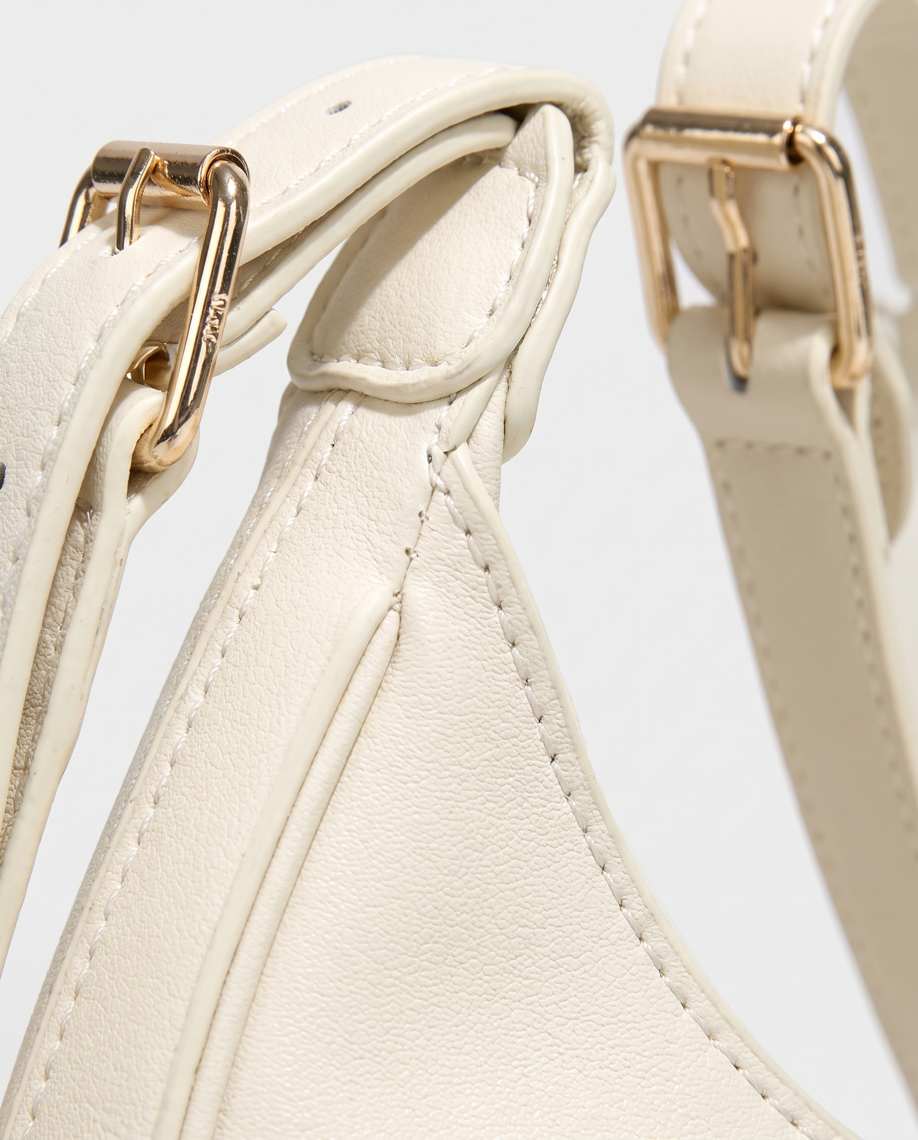 Crescent mini crossbody bag in white — texture detail, RABUKO