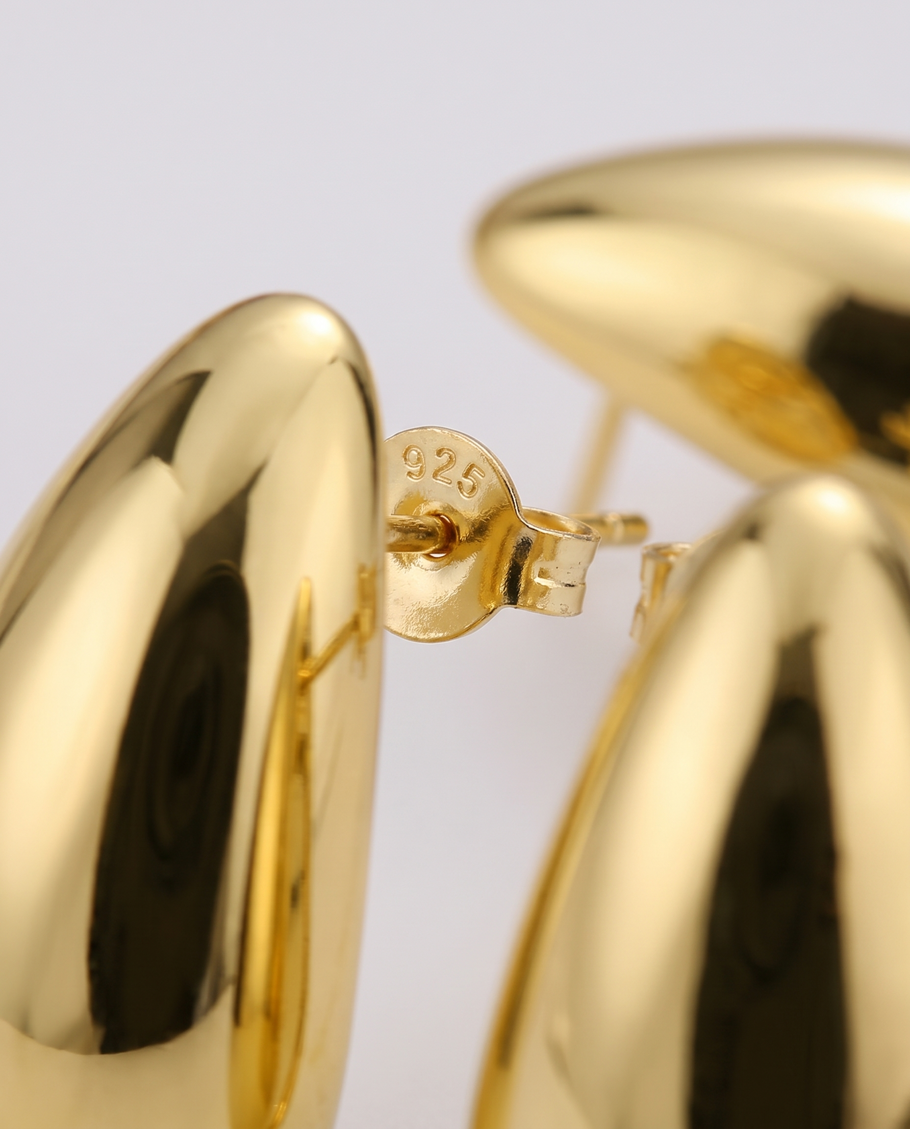 Gold-plated drop earrings — macro detail, RABUKO