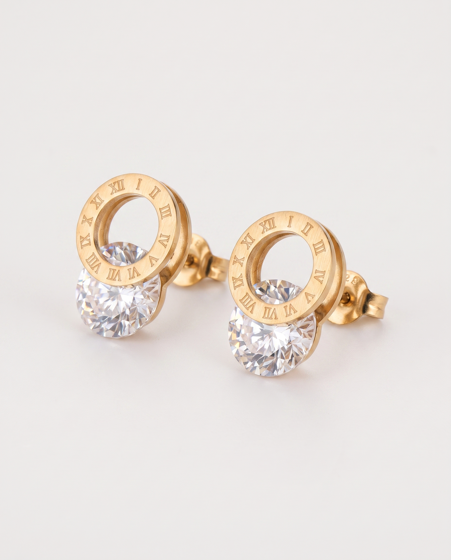 Titanium steel earrings in gold — three-quarter view, RABUKO