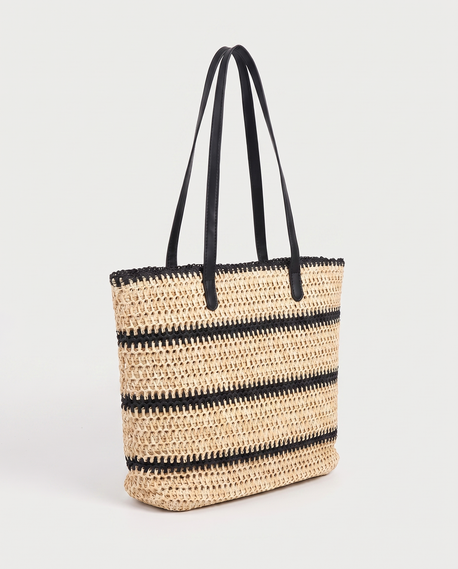 Striped Straw Shoulder Bag in black — three-quarter view, RABUKO