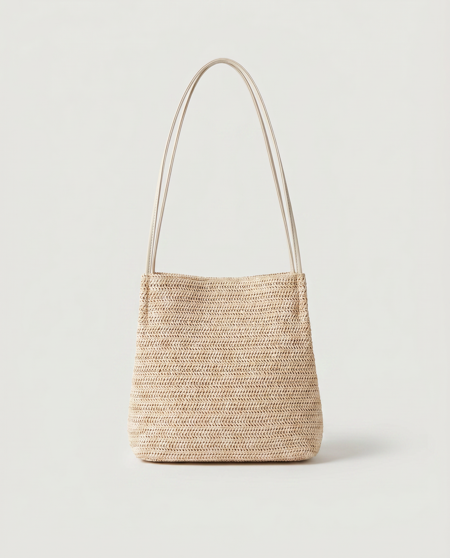 Mini Handwoven Straw Tote in light beige — front view, RABUKO