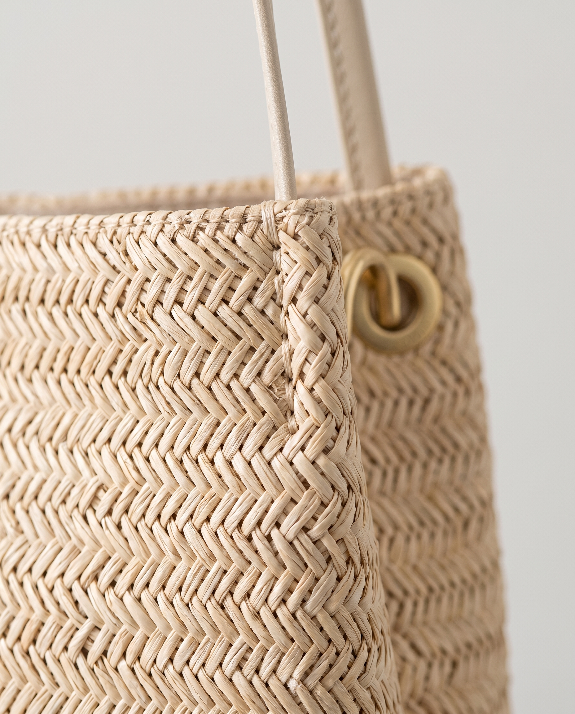 Mini Handwoven Straw Tote in light beige — weave texture detail, RABUKO