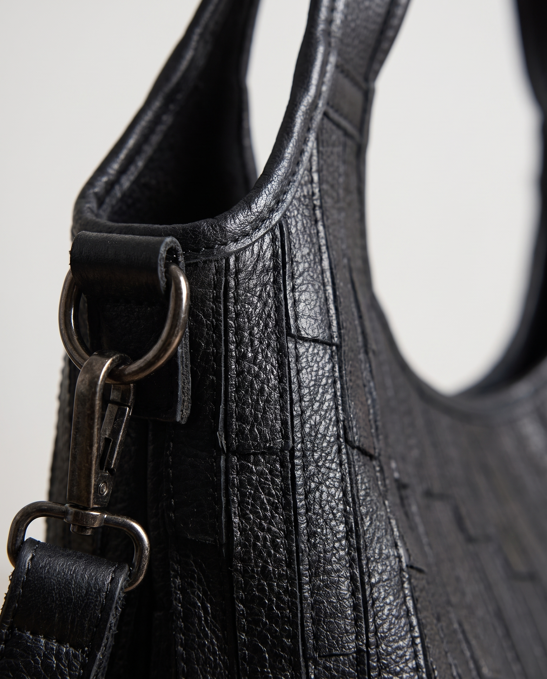 Striped Leather Messenger Bag in black — leather grain detail, RABUKO