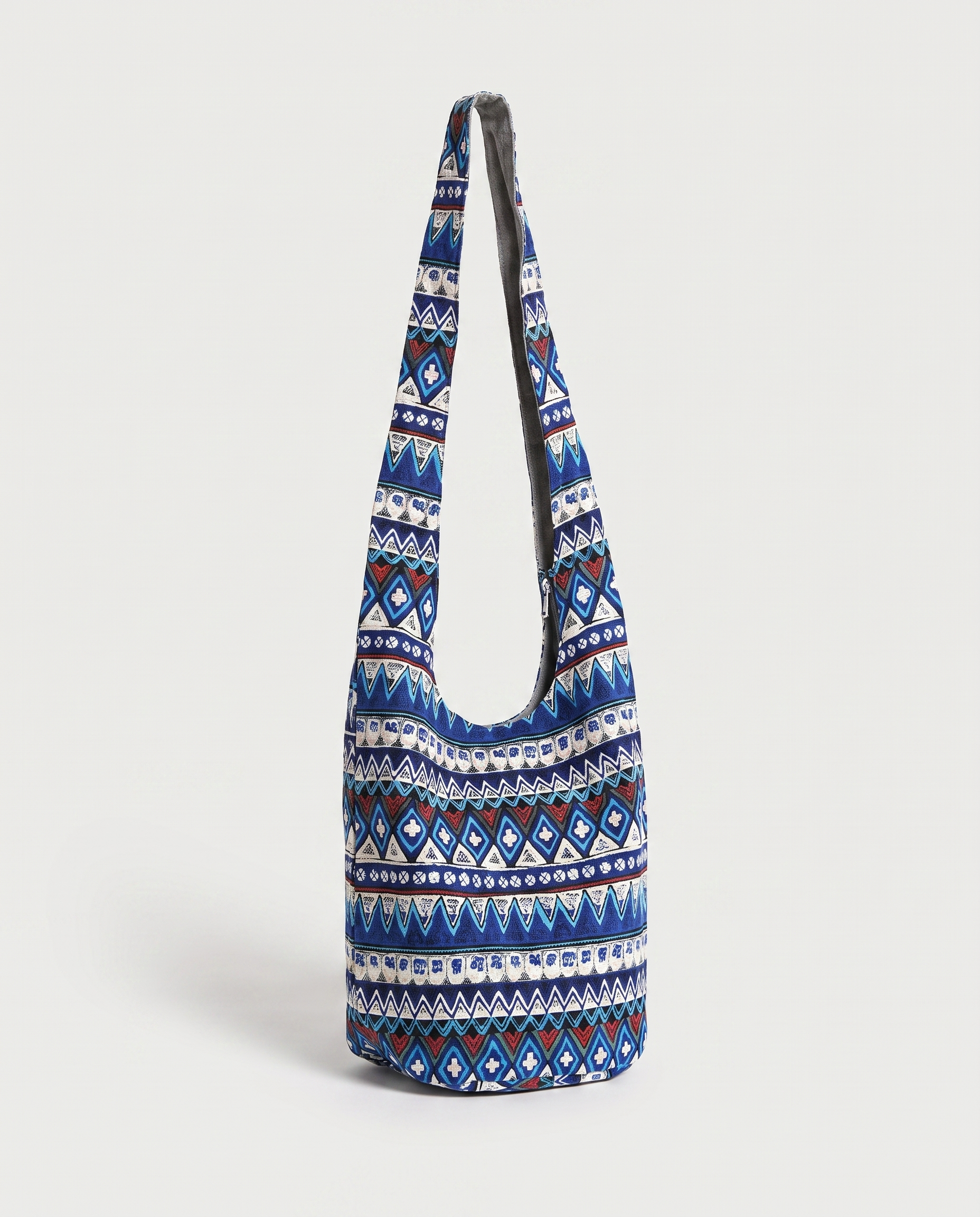 Print crossbody bag in blue — three-quarter view, RABUKO