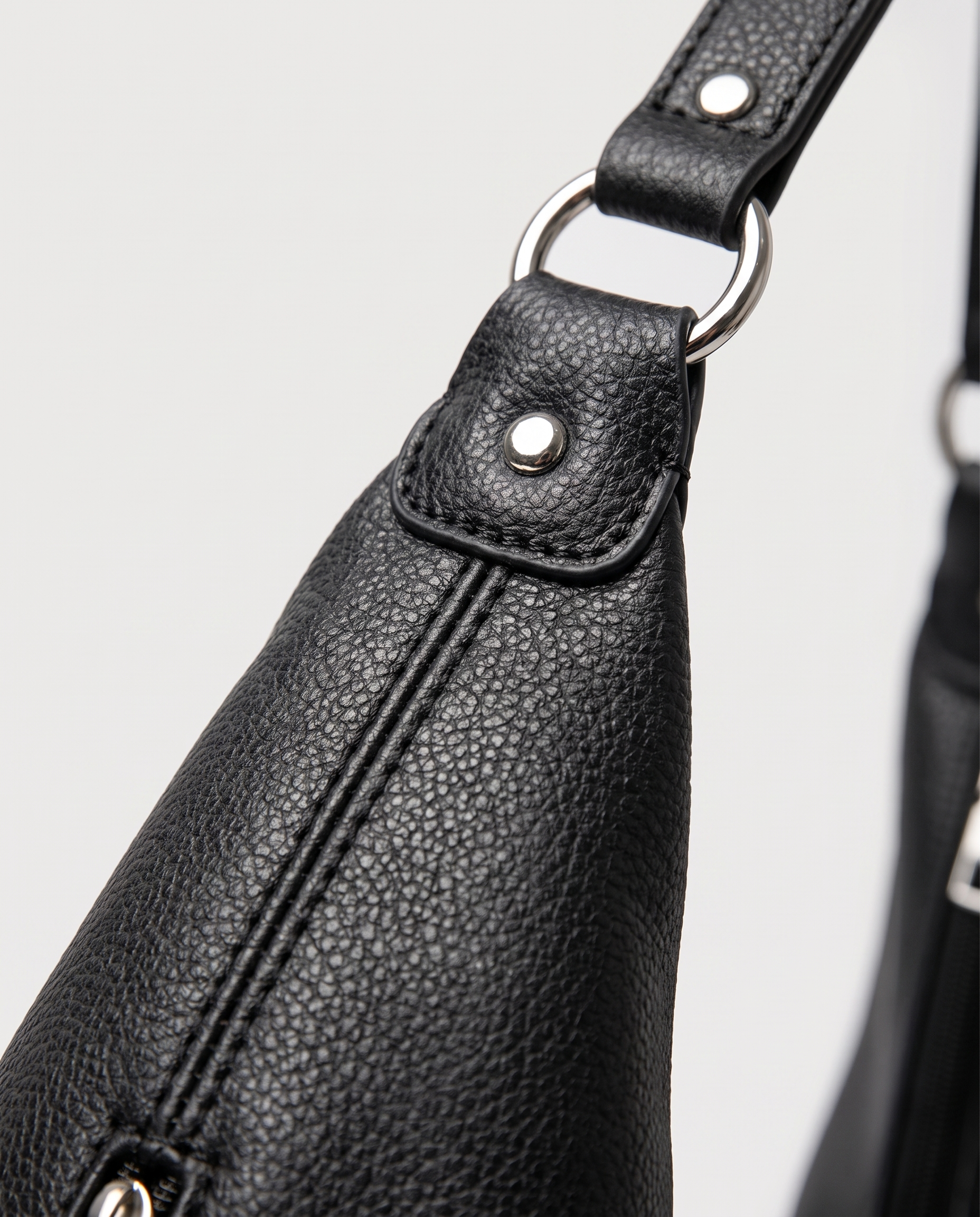 Stitched shoulder tote in black — texture detail, RABUKO