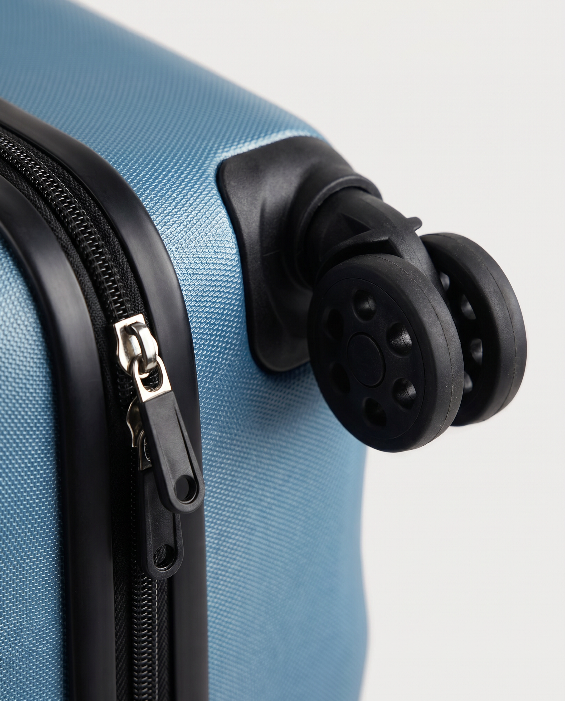 Foldable suitcase in blue — wheel and zip detail, RABUKO