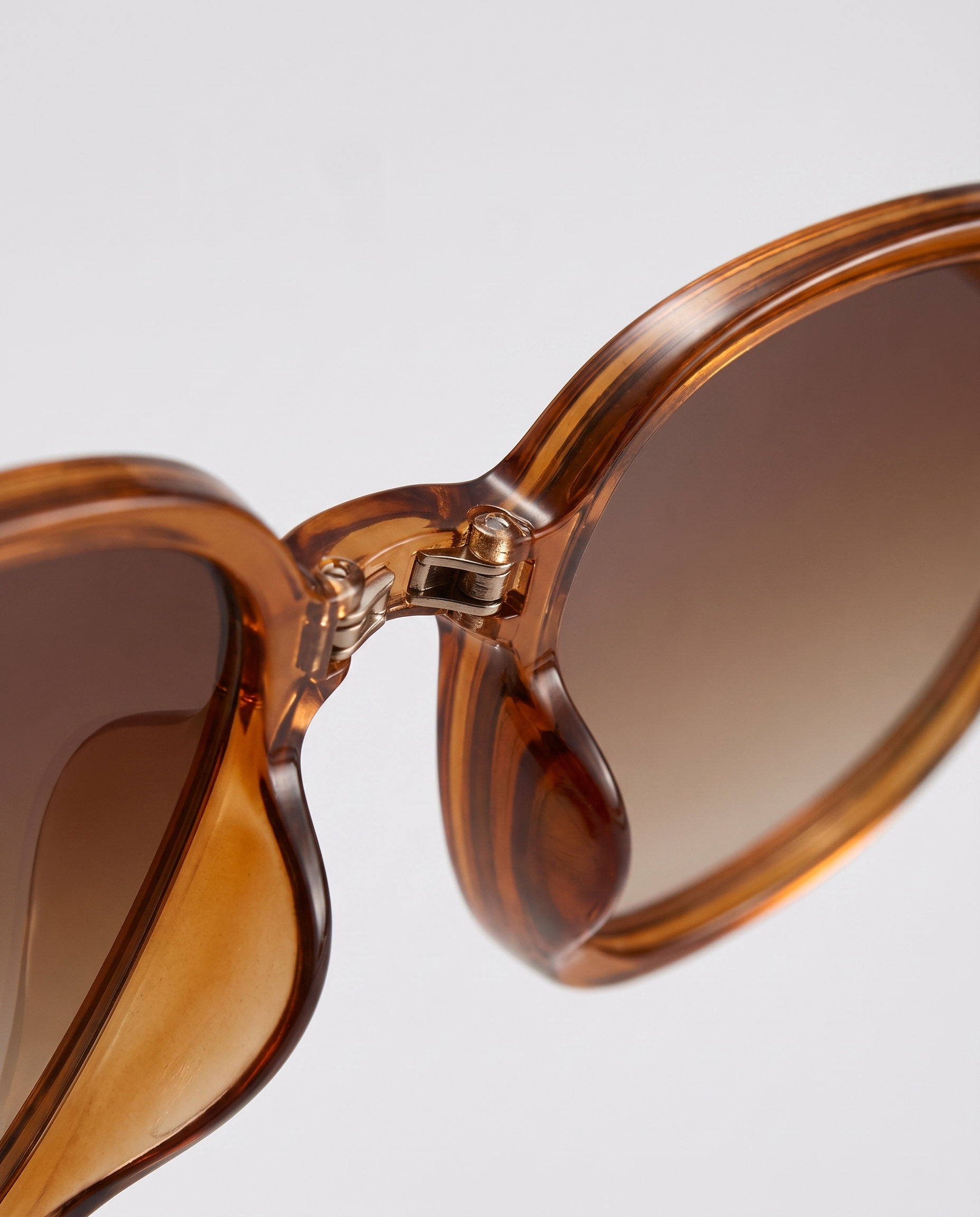 Folding sunglasses in brown — hinge detail, RABUKO
