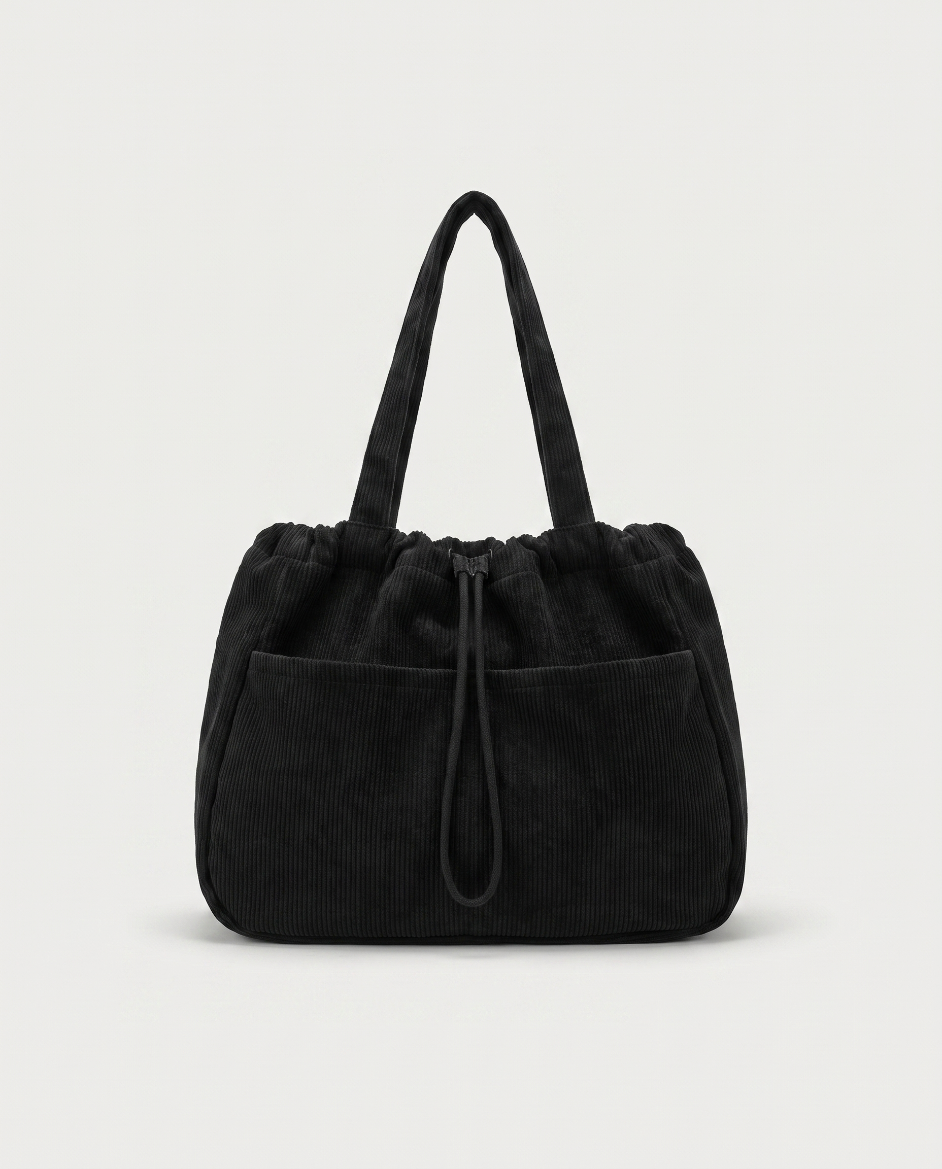 Corduroy drawstring bag in black — front view, RABUKO