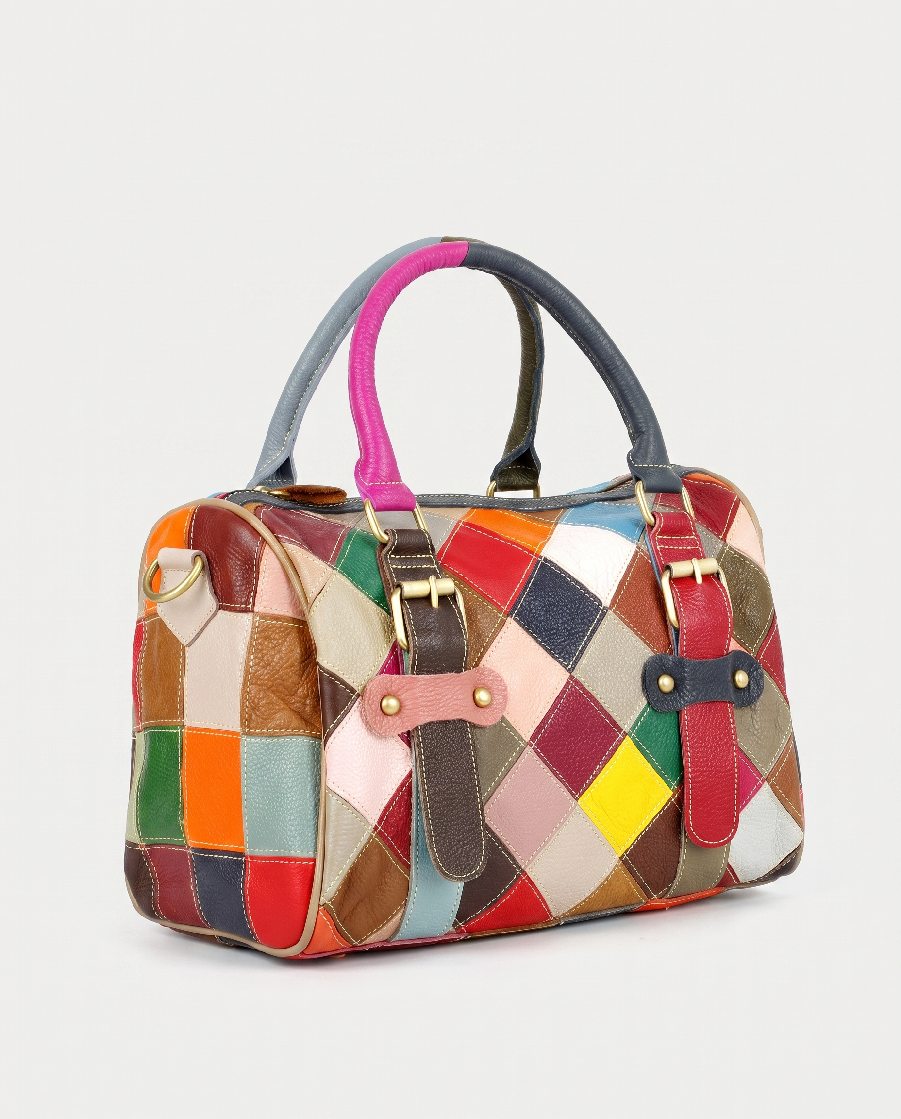 Cowhide patchwork handbag in multicolor — three-quarter view, RABUKO