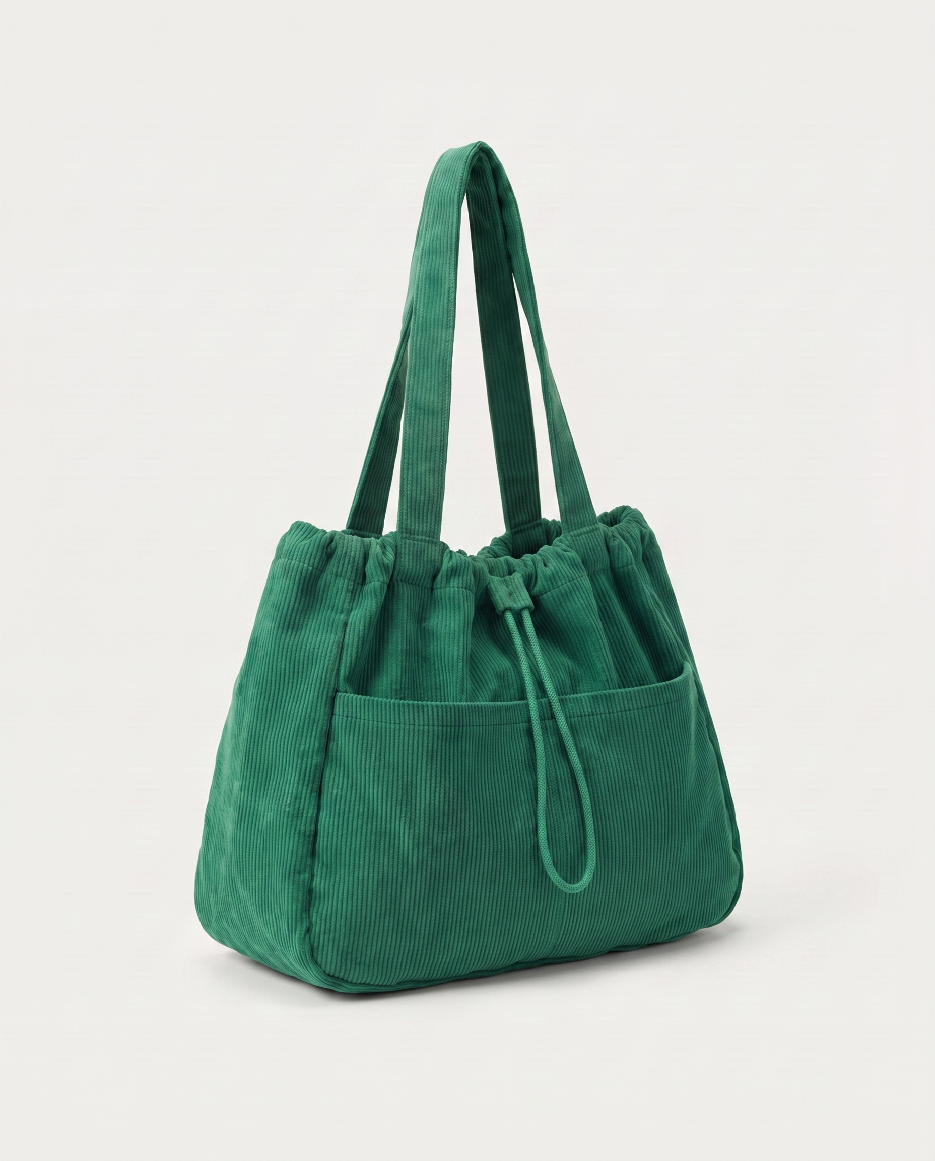 Corduroy drawstring bag in green — three-quarter view, RABUKO