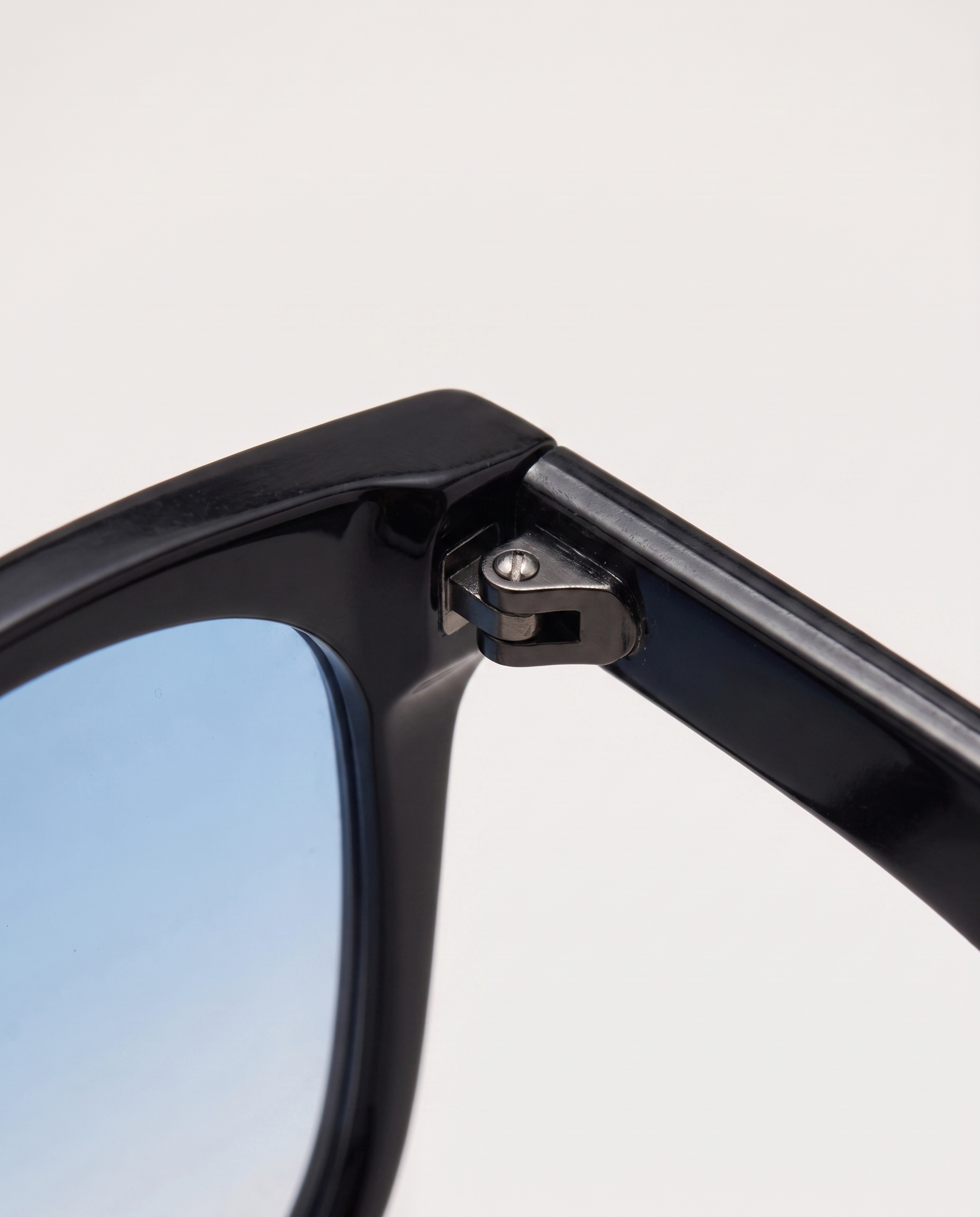 Folding sunglasses in blue — hinge detail, RABUKO