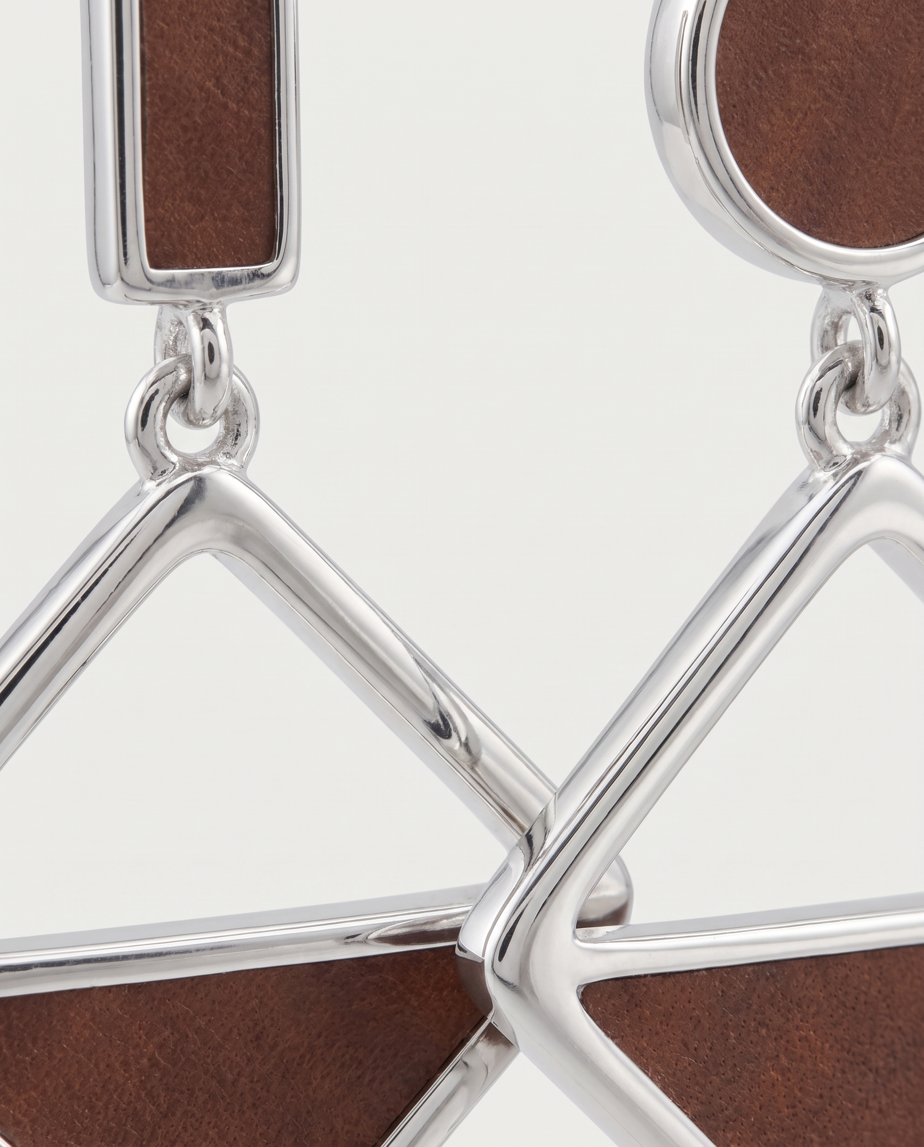 Asymmetric frosted heart earrings — macro detail, RABUKO