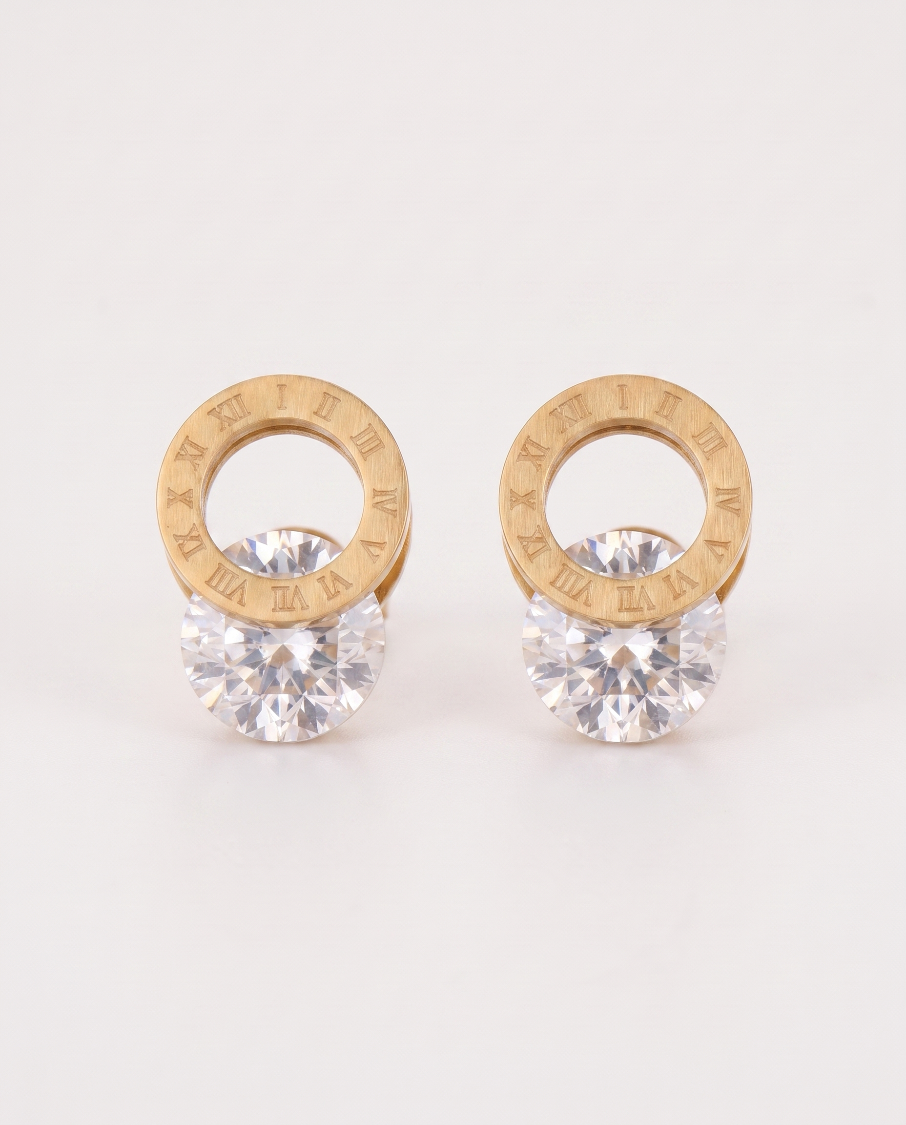 Titanium steel earrings in gold — front view, RABUKO